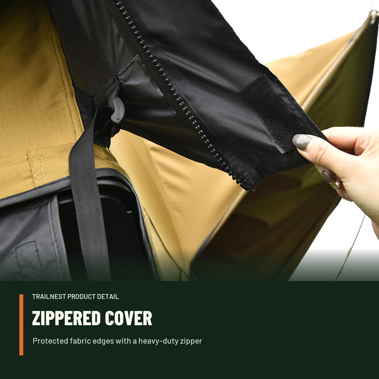 Hand operating the zippered protective cover on the TrailNest rooftop tent