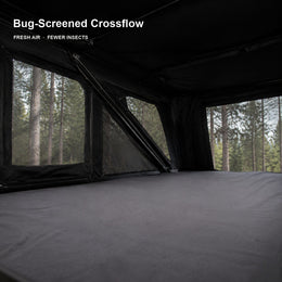 Bug-screened cross-flow ventilation inside the rooftop tent