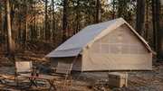 TrailNest inflatable cabin tent at a forest campsite