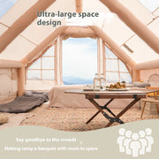 Interior of TrailNest Four-Season Inflatable Cabin Tent with a table and sleeping area