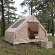 TrailNest inflatable cabin tent at a pine forest campsite