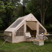 TrailNest inflatable cabin tent in light rain with water beading on fabric