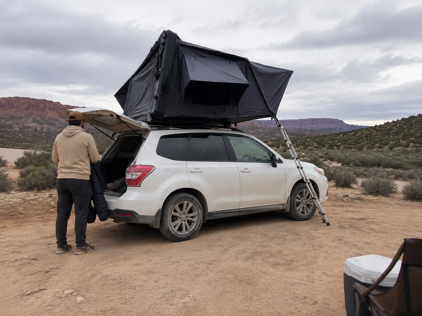 TrailNest Panorama High-desert base camp rear-quarter AI scene concept