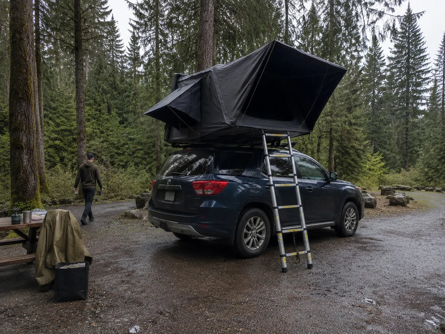 TrailNest Panorama Rainy-day reset rear-quarter AI scene concept