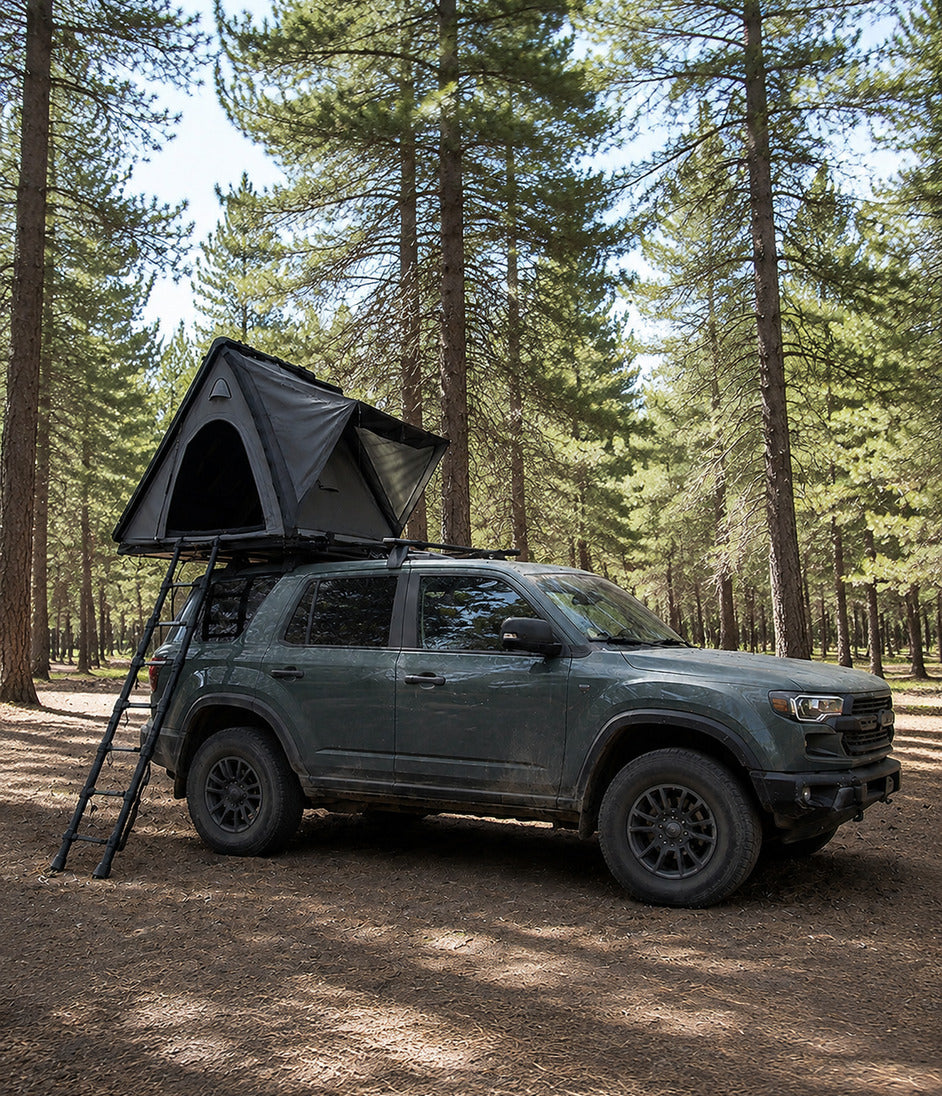 TrailNest Wedge 132 hard-shell rooftop tent in a wide-ratio mobile trial composition
