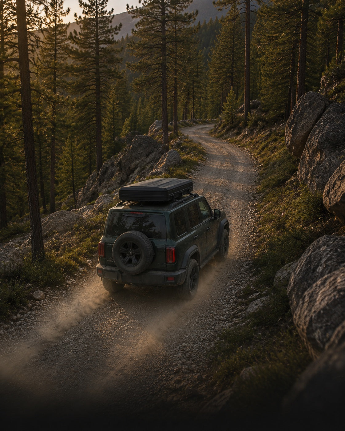 The same SUV and closed TrailNest rooftop tent continue along a winding pine-forest trail.